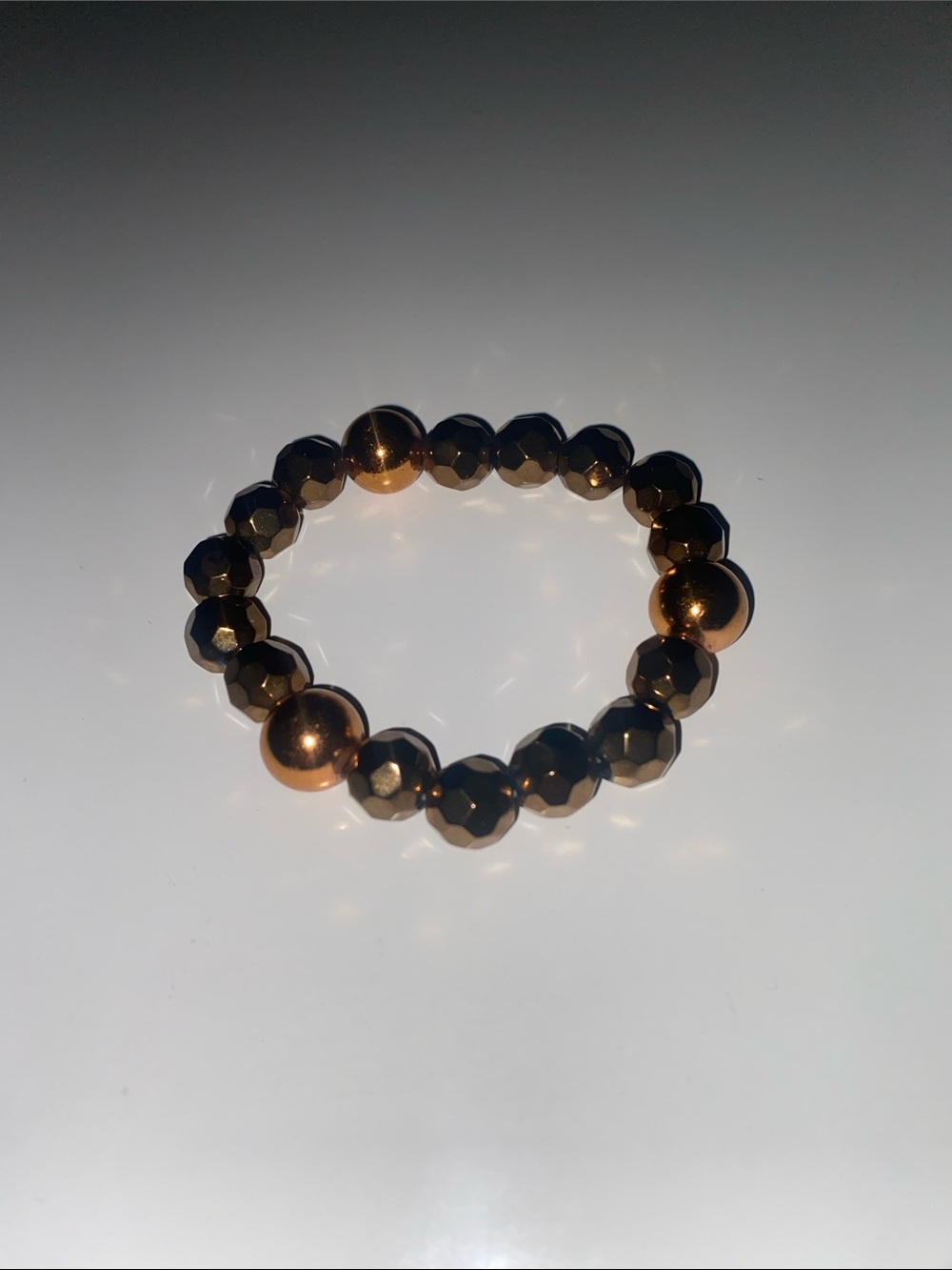 Faceted Hematite Bead Stretch Bracelet with Metallic Bronze Accents